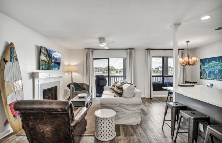 living room with couches and patio