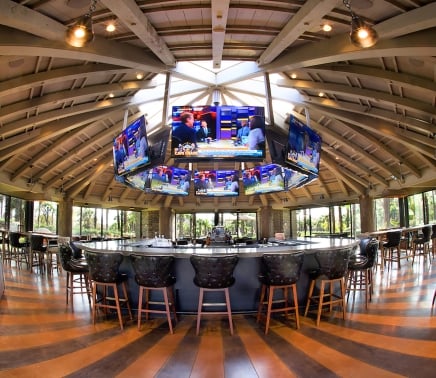 Sports bar with 360 views of TVs for all sport fans to watch.