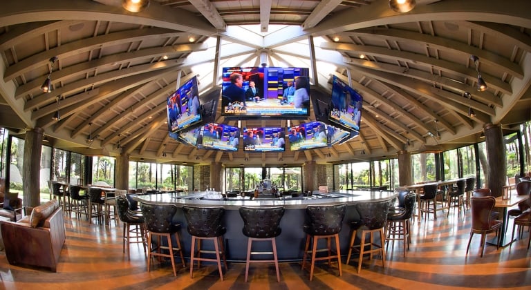 Sports bar with 360 views of TVs for all sport fans to watch.