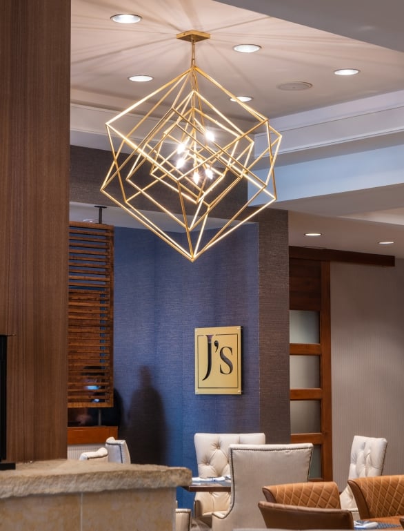 Hotel lobby with J logo on wall
