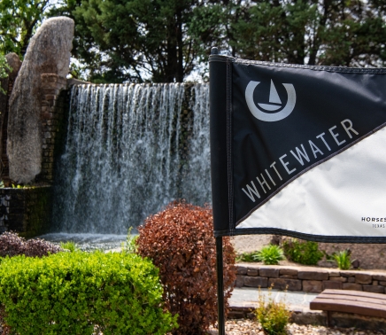 Whitewater Putting Course with flag and waterfall in the background