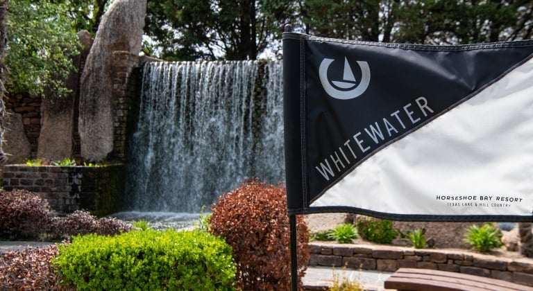 Whitewater Putting Course with flag and waterfall in the background
