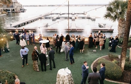 Groups of people standing outside enjoying a wedding at horseshoe bay resort