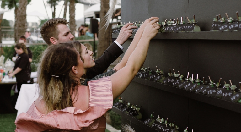 Woman picking party favors from the wedding display