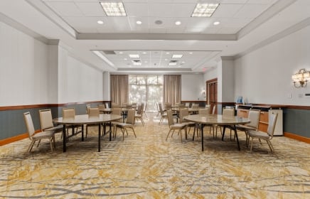 Meeting room with large windows allowing natural light to shine through