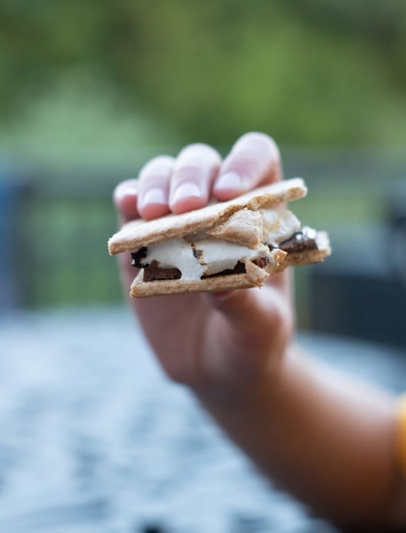 someone holding a smore while staying at horseshoe bay resort