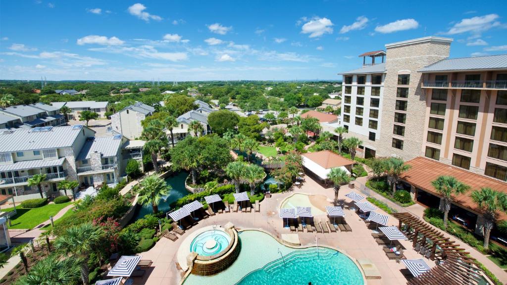 Pool view with loungers and patio