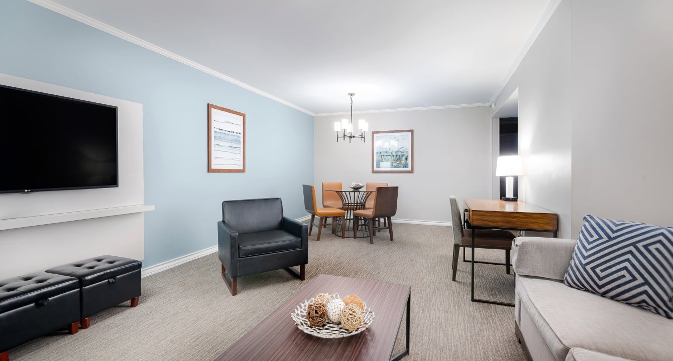 A living room at The Villa at Horseshoe Bay Resort with tables, chairs, couches and a open floor plan