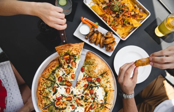 guests enjoying pizza and wings