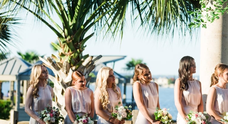 Bridesmaids admiring the bride as she gives her long-lasting vows