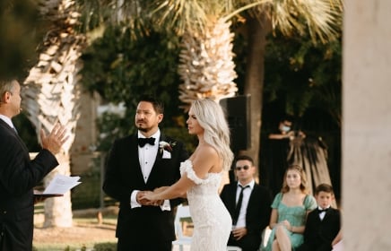 Man and woman at the alter getting married in the Texas Hill Country venue.