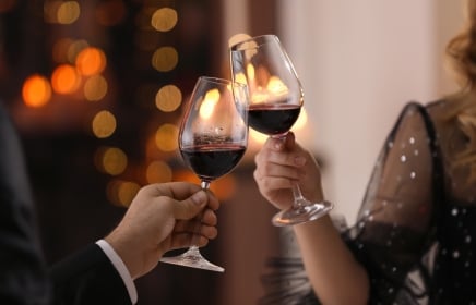 Two people enjoying glasses of wine