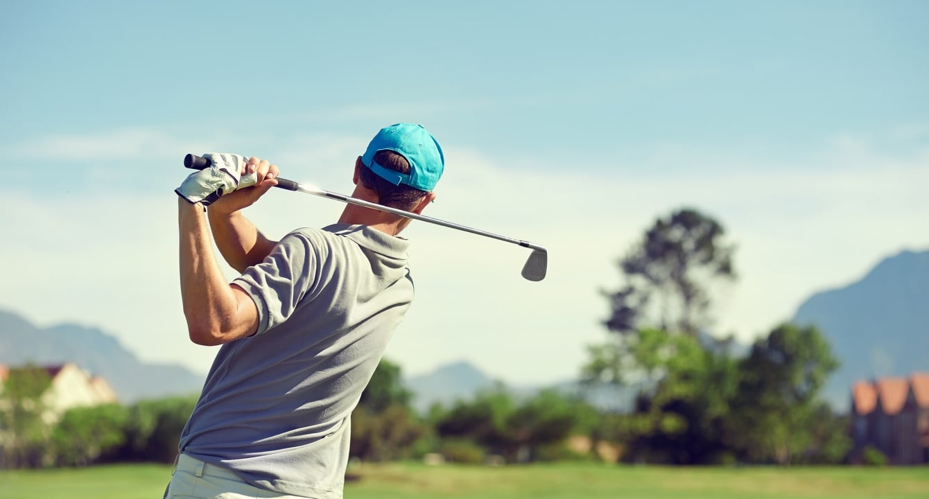 Man taking golf swing at Horseshoe Bay Resort