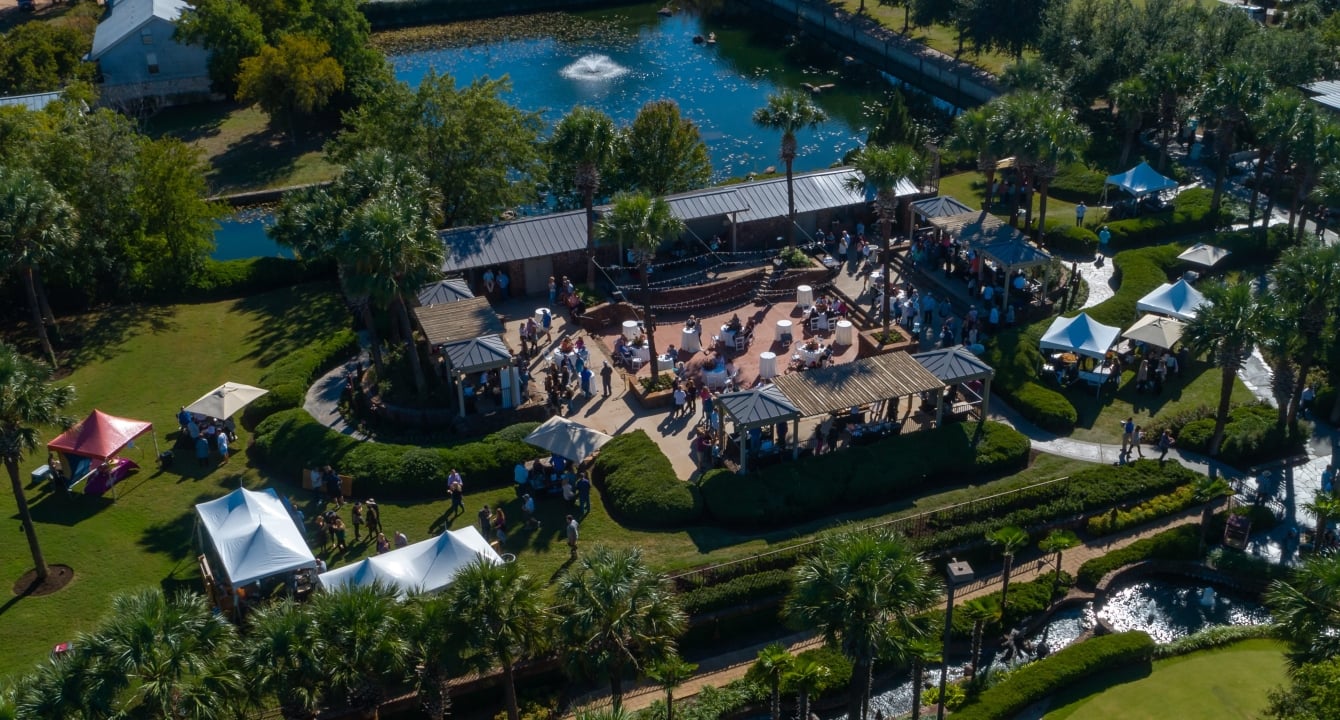aerial shot of the resort, tennis courts, outdoor patio, fountain