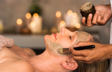 Side profile of a woman getting a Age Defying Facial.