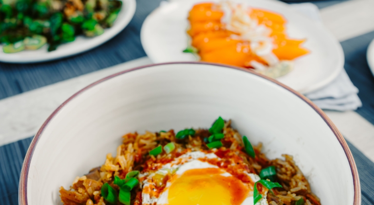 Duck fried rice with edamame, carrot, caramelized onion, Texi-Huli sauce, fried egg, and hot sauce at Waterfront Bar and Grill, Horseshoe Bay Resort.