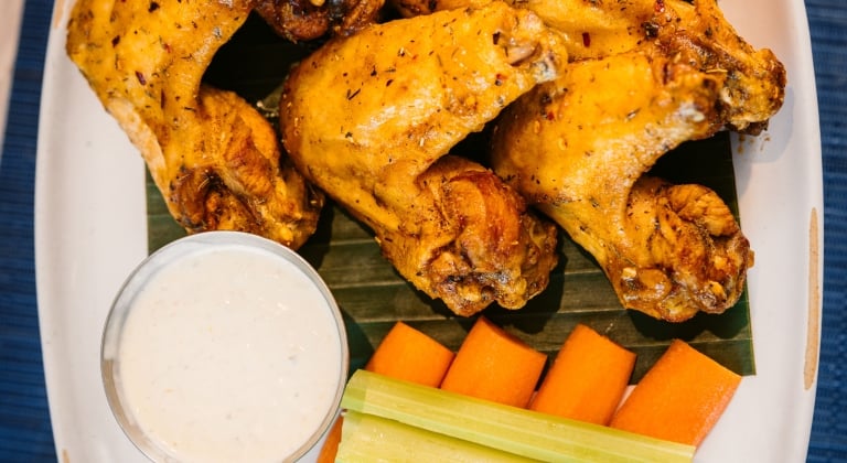 Dry rub jerk wings with mango habanero sauce and hatch chili ranch at Waterfront Bar and Grill in Texas Hill Country at Horseshoe Bay Resort.