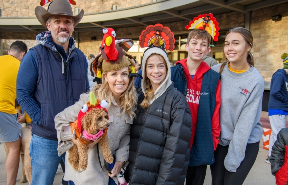 A family posing for a photo at the Turkey Trot