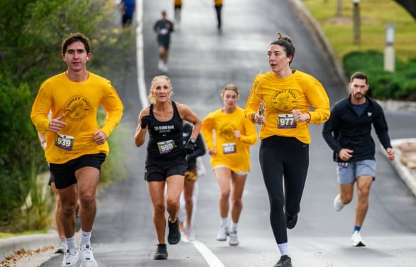 A group of people running in the Turkey Trot