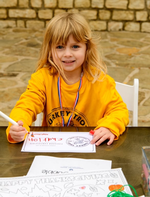 A child participating in Turkey Trot activities