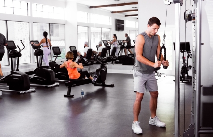 Man in the gym working on his arms at the Fitness Center