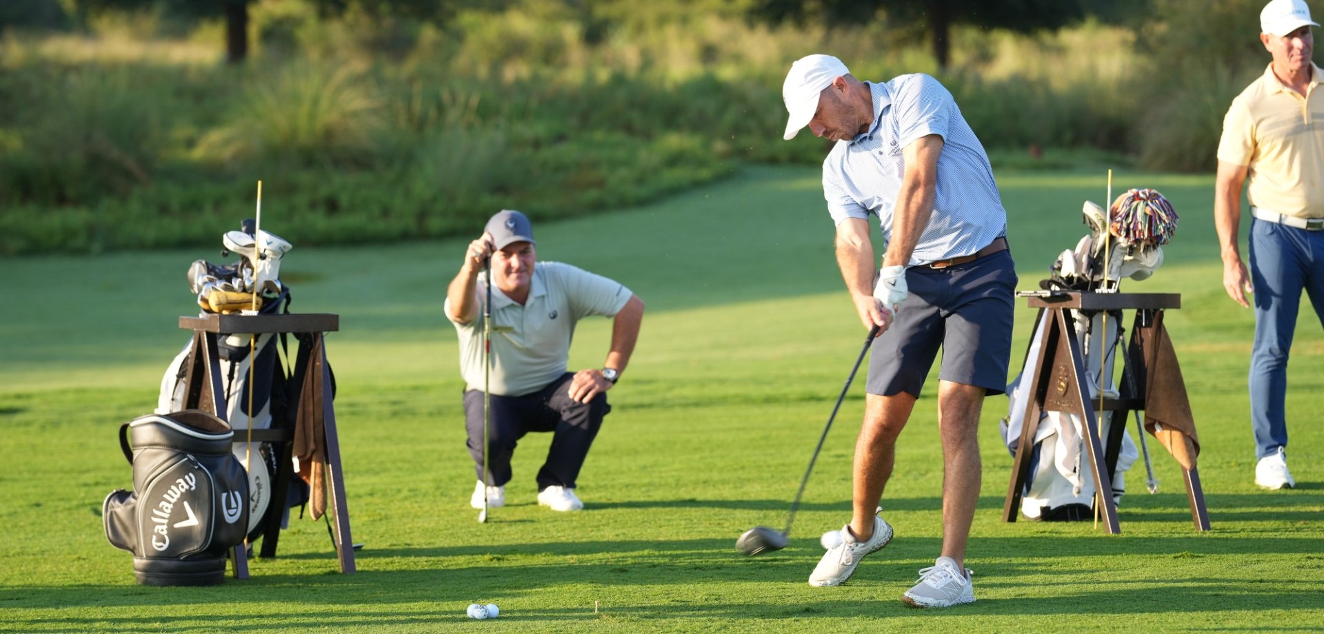 A group of men playing golf at the Golf Academy at Horseshoe Bay Resort