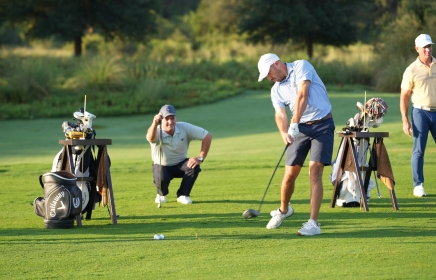 A group of men playing golf at the Golf Academy at Horseshoe Bay Resort