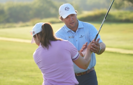 A coach and student at the Golf Academy at Horseshoe Bay Resort