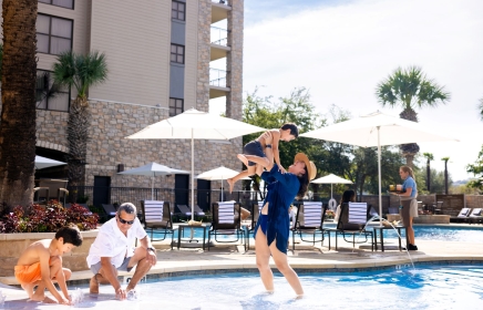 A family playing in the pool at Horseshoe Bay Resort