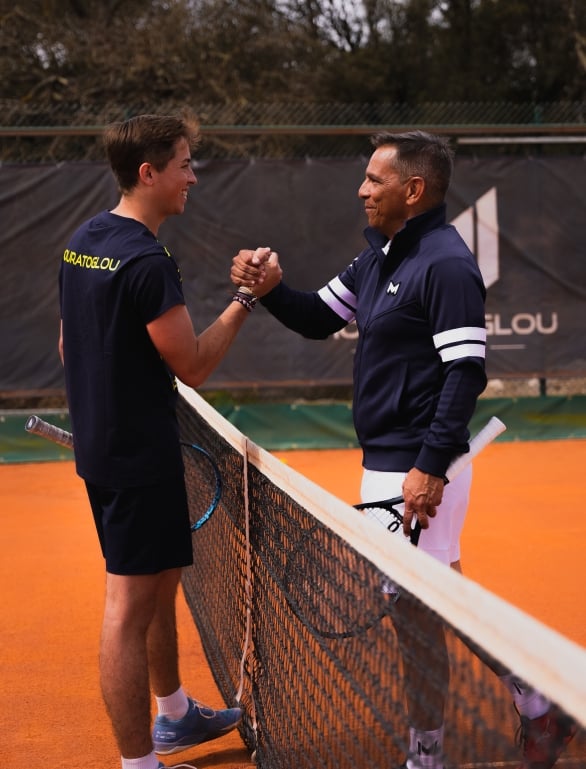 Two people shaking hands after a tennis match at Horseshoe Bay Resort