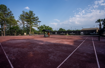 Red clay tennis courts at Mouratoglou Tennis Center at Horseshoe Bay Resort
