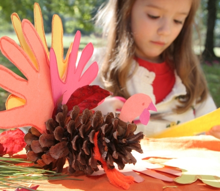 Fall arts and crafts with young girl.