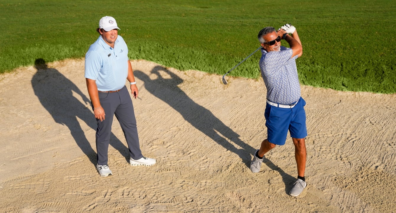Man taking golf lessons at Horseshoe Bay Resort