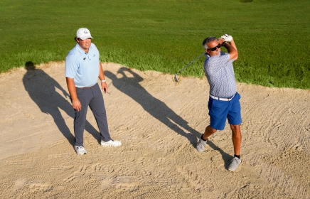 Man taking golf lessons at Horseshoe Bay Resort