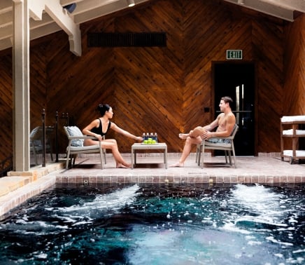 Couple sitting poolside