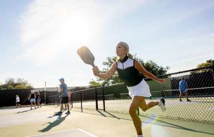 Older woman playing pickleball