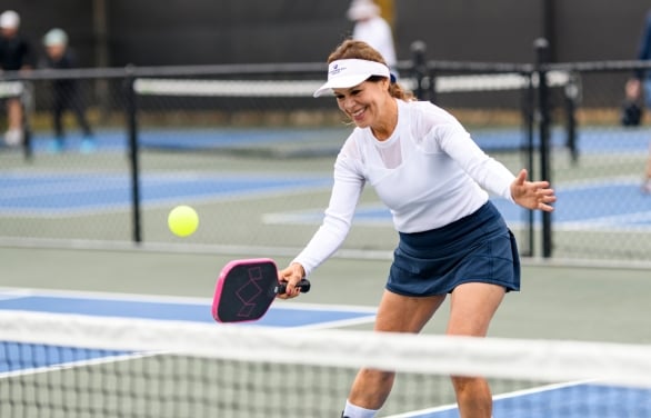 A woman playing Pickle Ball