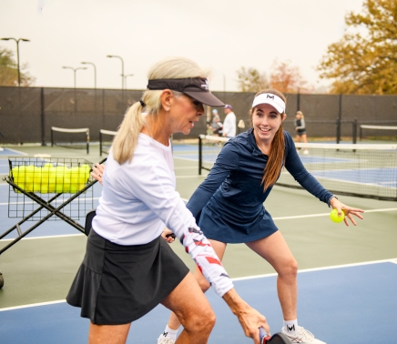 Group of people playing Pickle Ball