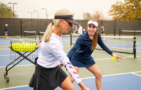 Group of people playing Pickle Ball