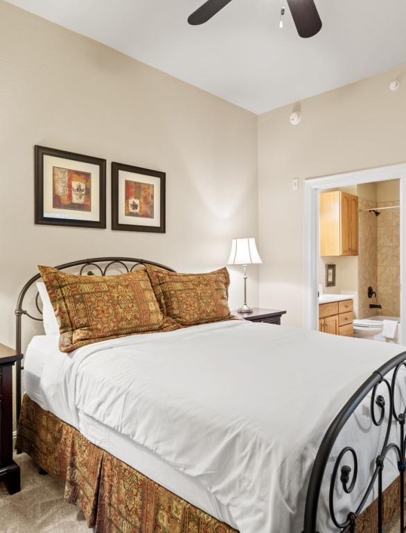 A bedroom & bathroom view of a condo at Horseshoe Bay Resort