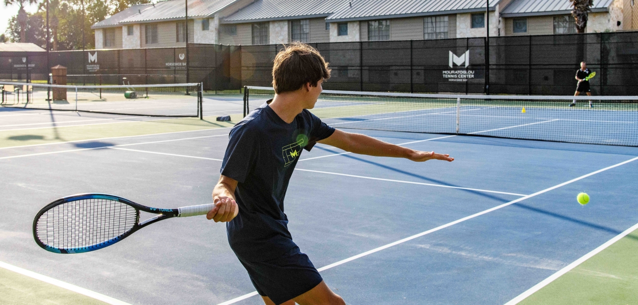 People enjoying a game of tennis at Horseshoe Bay Resort