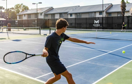 People enjoying a game of tennis at Horseshoe Bay Resort