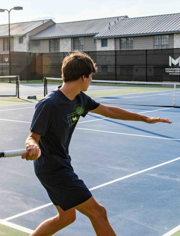 People enjoying a game of tennis at Horseshoe Bay Resort