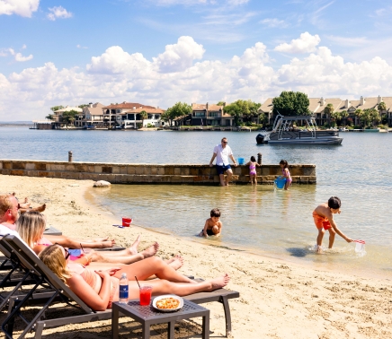 Groups of people enjoying a day at the beach at Horseshoe Bay Resort
