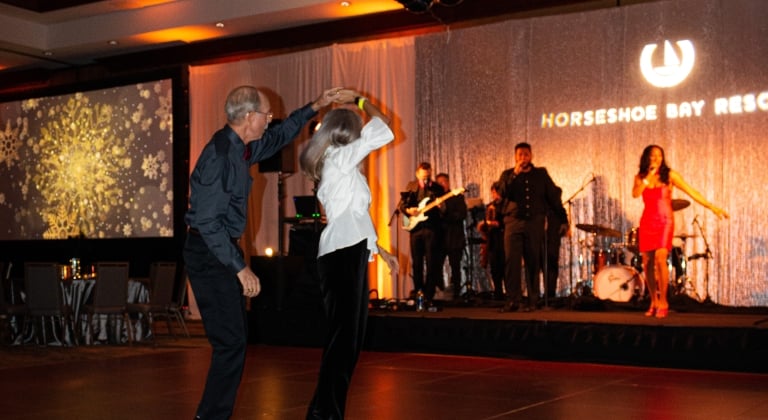 People dancing on the dance floor at a New Years Eve party hosted by Horseshoe Bay Resort