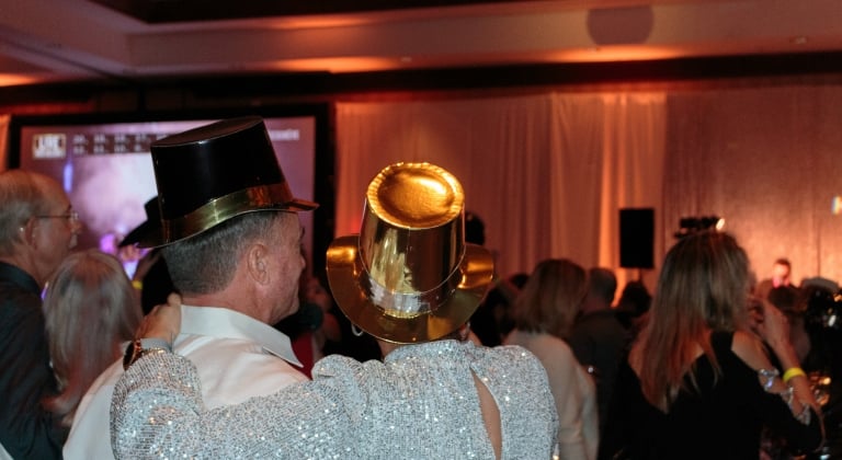 Backside view of people enjoying a New Years Eve party