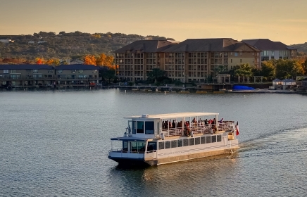 A tour boat on the water at Horseshoe Bay Resort