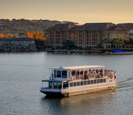 A tour boat on the water at Horseshoe Bay Resort