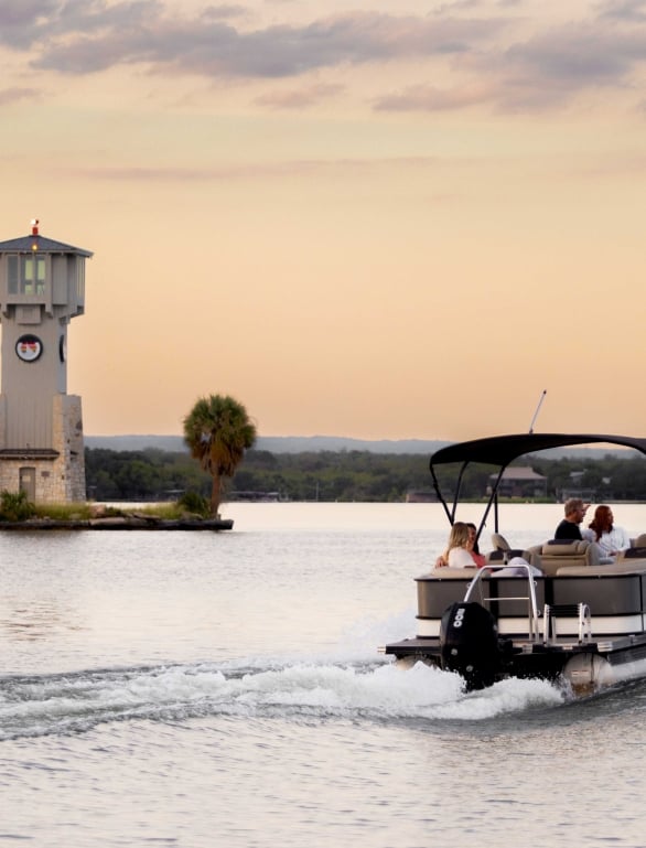 people enjoying a boat ride on the water at Horseshoe Bay Resort