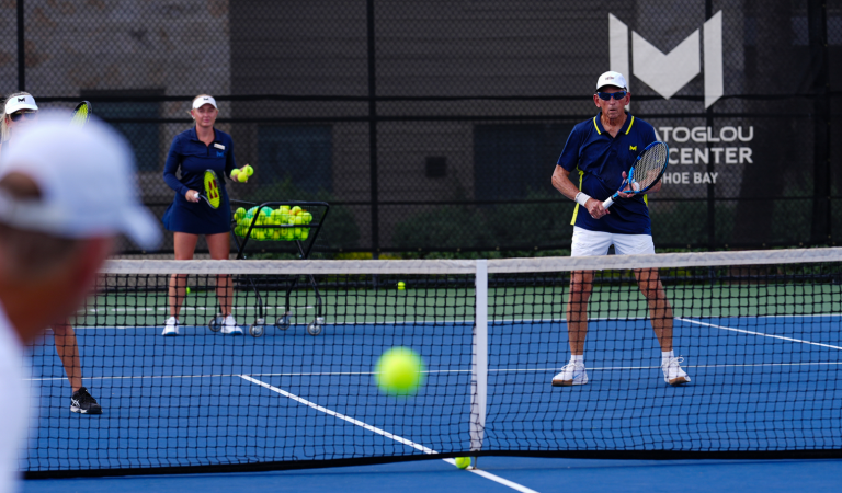 People enjoying a game of tennis at Horseshoe Bay Resort